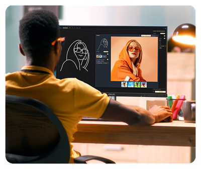 Ein KI-Künstler verwendet ein ProArt Display PA27JCV, um ein digitales Gemälde einer Frau zu erstellen, die einen leuchtend orangefarbenen Kapuzenpullover trägt.